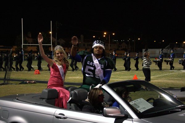 Homecoming queen Lexi George and king Brigham Tauteoli ride around ...