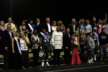 Members of the Green Valley homecoming court stand in front of the football field during halftime of Friday's game against Liberty.