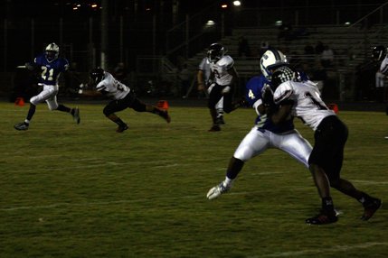 Basic's Anthany Lessier avoids a Las Vegas defender while Billy Weathers (4) blocks Riyaadh Nevins (13).