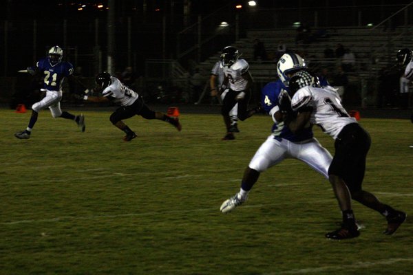 Basic's Anthany Lessier avoids a Las Vegas defender while Billy ...