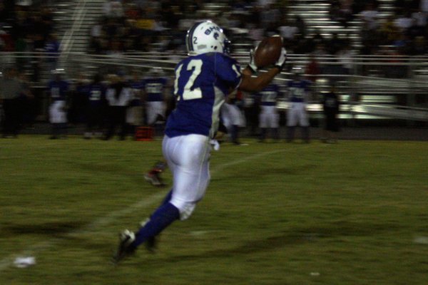 Basic's Justin Burdno catches a pass during Friday's game at ...
