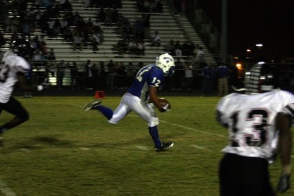 Basic's Justin Burdno runs with the ball during Friday's game against Las Vegas.