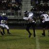 Las Vegas quarterback Emir Lopez (7) hands the ball off to running back Reggie Bullock (5) during Fr