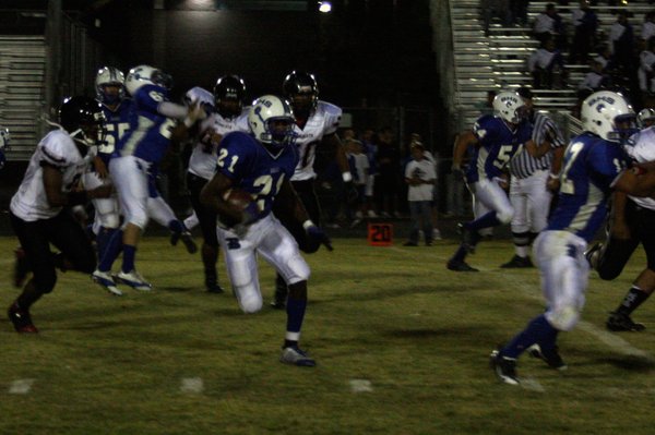 Basic wide receiver Anthany Lessier (21) runs with the ball ...