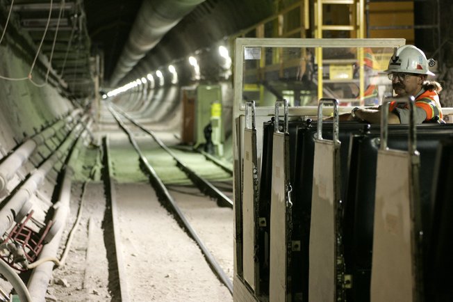 A train operator waits for passengers at the Yucca Mountain Exploratory Studies Facility in 2006. The Energy Department plans to ship an average of 3,000 tons of waste to Yucca each year for 24 years.