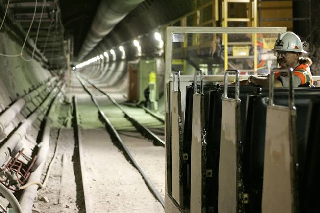A train operator waits for passengers at the Yucca Mountain Exploratory Studies Facility in 2006. 