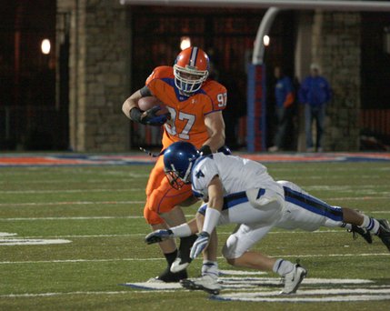 Bishop Gorman defensive end Justin Chaisson (97) barrels over a Sierra Vista player at the Gaels' homecoming game Friday. The Gaels pummeled the Mountain Lions, 41-26. 