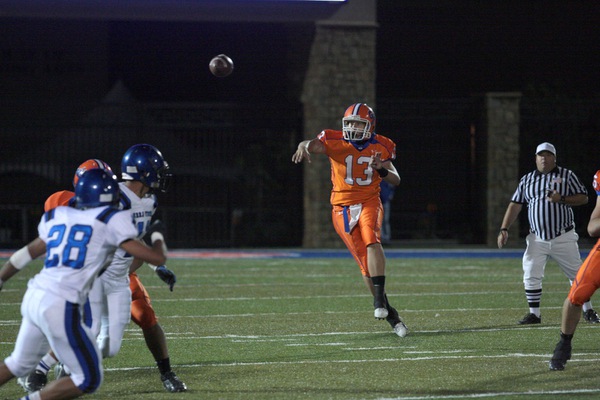 Bishop Gorman's Chase Cresto throws the ball in the fourth ...