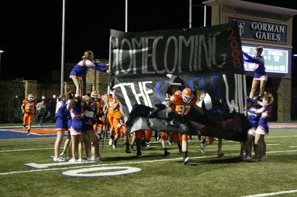 The Gaels make an entrance at the team's homecoming game Friday. 
