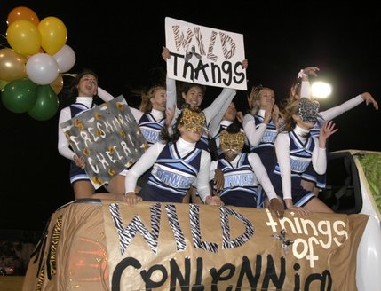 The freshman cheer group participates in the parade during halftime of Friday's game between the Bulldogs and visiting Aggies at Centennial High on Friday.