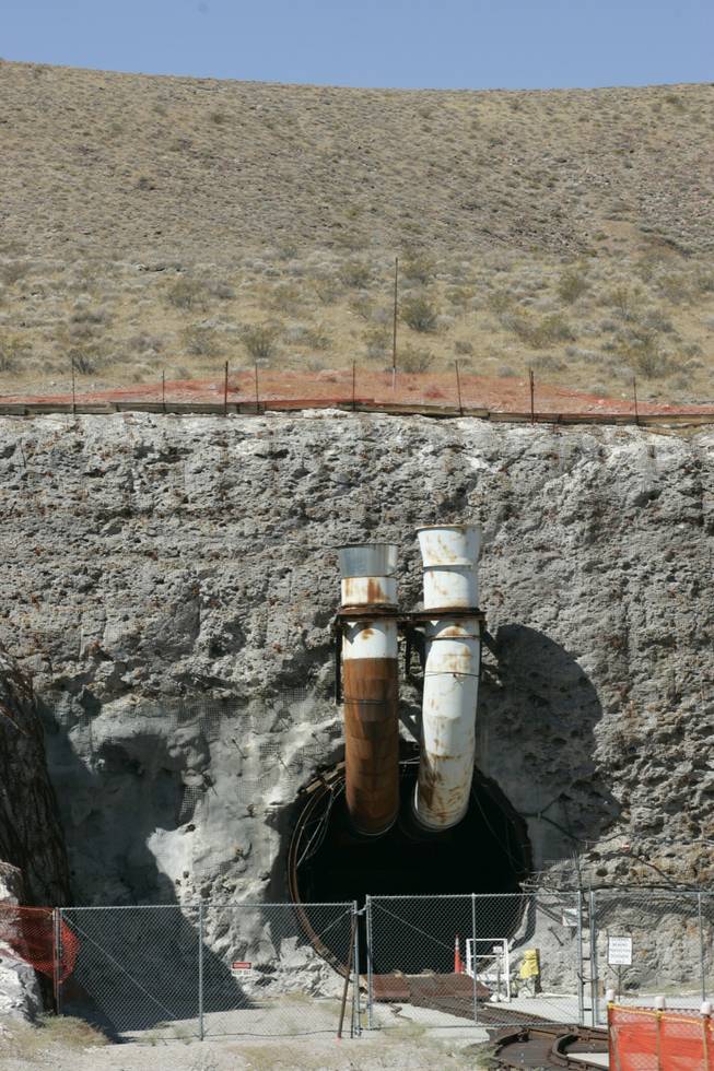One thousand feet underneath Yucca Mountain is the horseshoe-shaped tunnel into which waste would be carried for disposal, should the Energy Department's plan for the dump be approved. Ventilation pipes jut out from its portals. 