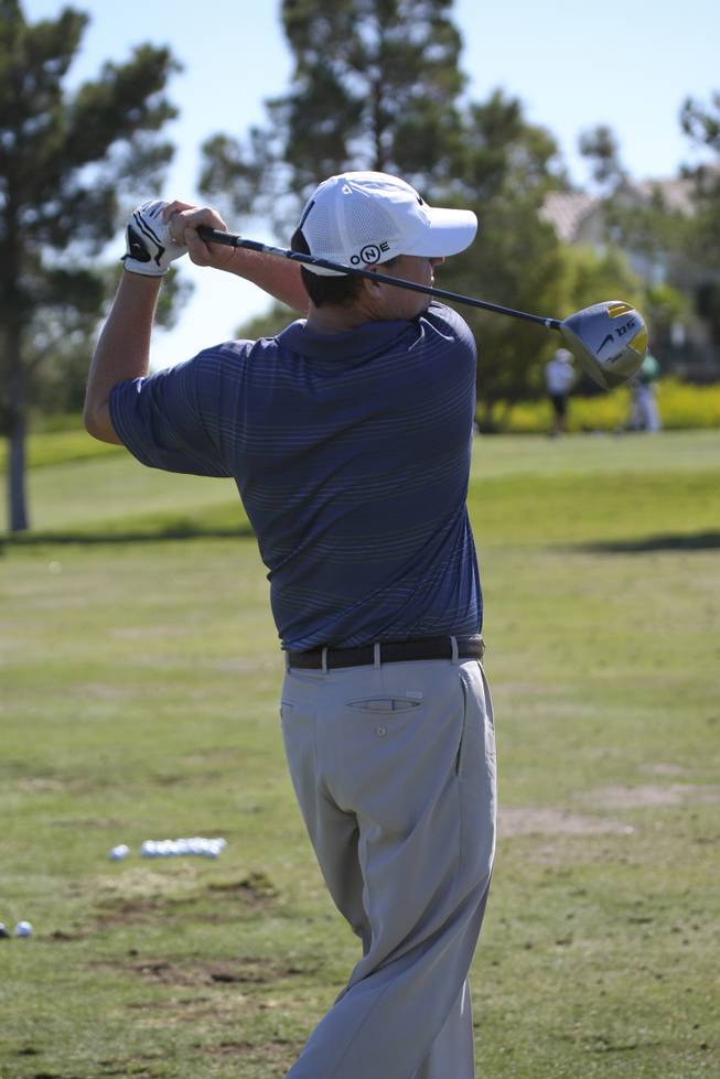 Former UNLV golfer Chad Campbell hits on the driving range during the practice rounds at TPC Summerlin Golf Course during the Justin Timberlake Shriners Hospitals for Children Open Tuesday.