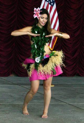 A hula dancer entertains the crowd Wednesday before Hawaii Gov. Linda Lingle speaks in support of presidential nominee Sen. John McCain.