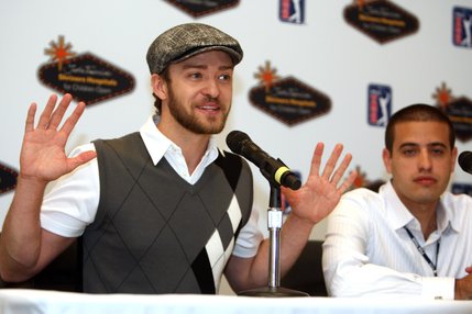 Justin Timberlake gives a funny gesture during a news conference at TPC Summerlin in Las Vegas on Wednesday, October 15, 2008. Nelson Silverio II, manager of PGA Tour media information, listens at right. The Justin Timberlake Shriners Hospitals for Children Open, part of the PGA Tour's fall series, will be played at the course through Sunday. The event will be televised on the Golf Channel.
