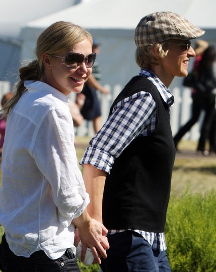 Ellen DeGeneres, right, walks with her partner Portia de Rossi during the Justin Timberlake Shriners Hospitals for Children Open Celebrity Pro-Am at TPC Summerlin in Las Vegas on October 15, 2008.

