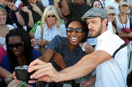 Justin Timberlake takes a photo with fan Adriennne Agustus after the Justin Timberlake Shriners Hospitals for Children Open Celebrity Pro-Am at TPC Summerlin in Las Vegas on October 15, 2008. The tournament, part of the PGA Tour's fall series, will be played through Sunday and televised on the Golf Channel.