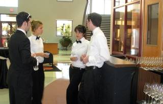 UNLV hospitality majors discuss their roles in the annual Chef Artist Series at the Stan Fulton Building on campus. The students were cocktail servers for the evening.