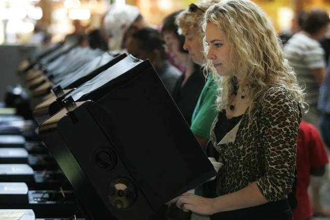 First-time voter Kirsten Garlock joins hundreds of others as she casts her ballot at the Sunset at Galleria mall in Henderson, Saturday, Oct. 18, 2008.