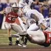 UNLV defensive back Beau Orth, left, and defensive end Heivaha Mafi take down Air Force's Asher Clark during the first half of action in a 29-28 Falcons victory at Sam Boyd Stadium on Oct. 18, 2008.