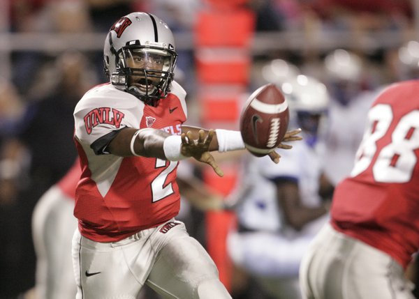 UNLV quarterback Omar Clayton pitches a lateral during the first ...
