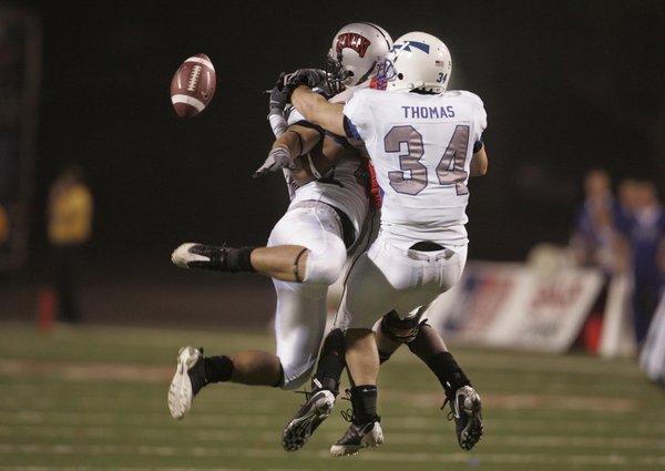 UNLV wide receiver Jerriman Robinson gets sandwiched by Air Force ...