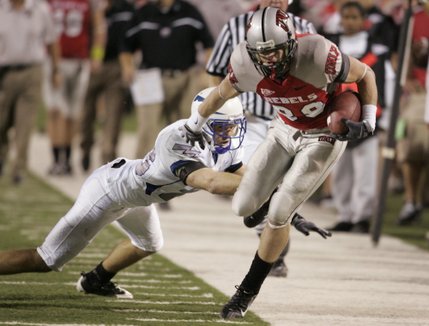 UNLV wide receiver Ryan Wolfe tries to stay in bounds as Air Force safety Aaron Kirchoff pushes him out during Saturday's game at Sam Boyd Stadium. Air Force won the game, 29-28. 