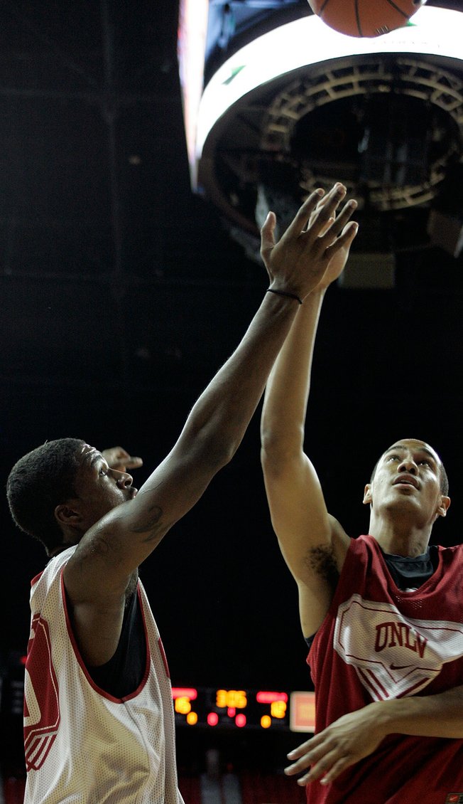 UNLV players Chace Stanback, right, and DeShawn Mitchell fight for a rebound during a scrimmage at the UNLV basketball team's first practice at Thomas & Mack on the campus of UNLV on Friday.

