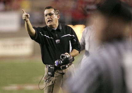 UNLV head coach Mike Sanford yells to officials to put time back on the clock during the second half of Saturday's game against Air Force at Sam Boyd Stadium.