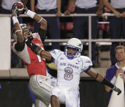 UNLV wide receiver Phillip Payne pulls in a touchdown pass over Air Force cornerback Reggie Rembert in the first half of Saturday's game.
