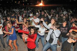 As the music blares through the darkness, Boulder City High students dance to 