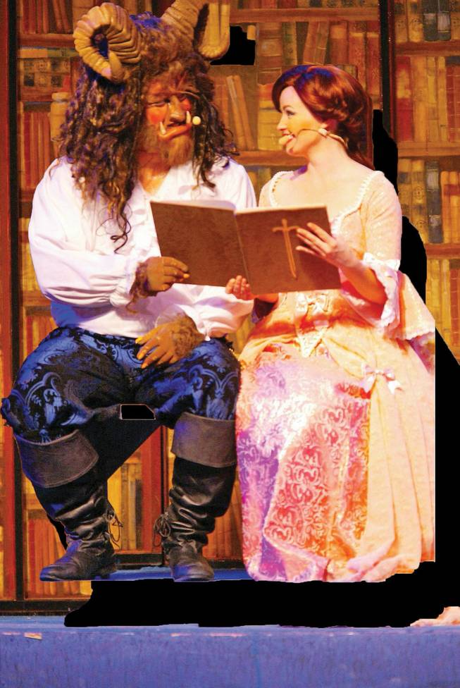 Al Mendoro, left, plays the Beast and Kari Curletto plays Belle during a practice for Signature Production's upcoming performances of "Beauty and the Beast" at the Summerlin Library and Performing Arts Center.