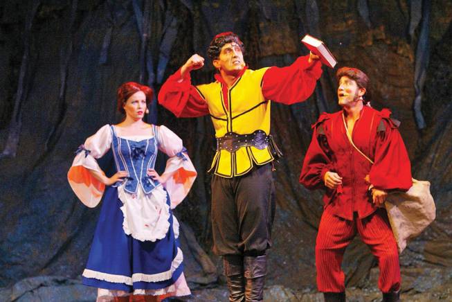 From left, Kari Curletto as Belle, Erik Ball as Gaston and Evan Litt as LeFou practice for Signature Production's upcoming performances of "Beauty and the Beast" at the Summerlin Library and Performing Arts Center.