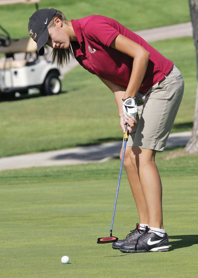 Faith Lutheran's Ashley Lacher putts during the 3A Southern League Golf Tournament at Boulder City Golf Course on Thursday.