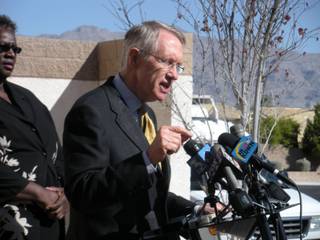 Sen. Harry Reid addresses reporters on a plan to end the housing crisis for Las Vegas. Reid is standing outside a foreclosed home in the hardest hit neighborhood, zip code 89131.