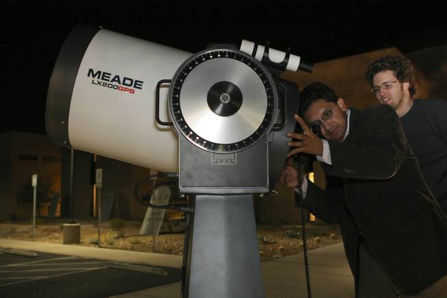 Professor Sandip Thanki, left, aids senior Matt Mitchell in locating Jupiter's giant storm, which is larger than Earth, while using the newly acquired Meade 200LXGPS 16-inch reflector telescope during astronomy class at Nevada State College.