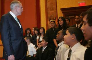 Sen. Harry Reid talks with students from the Academy of Finance at Clark High School before giving a speech to the Asian Chamber of Commerce at South Point Hotel and Casino on Thursday.