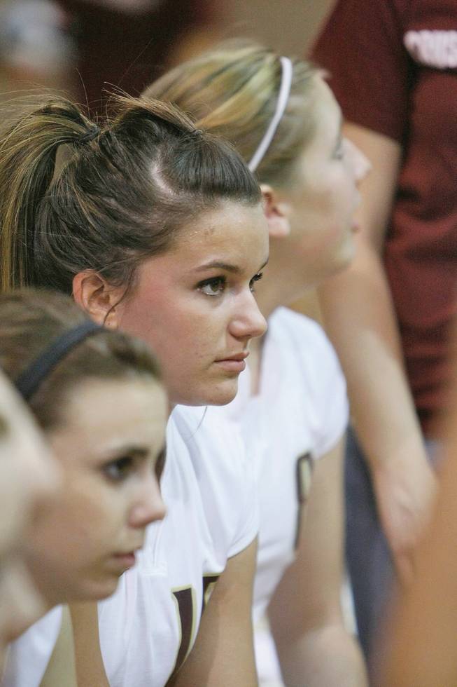 Hayley Washinsky (center), a junior on Faith Lutheran girls volleyball listens during a time-out in a game against Lake Mead Christian Academy.