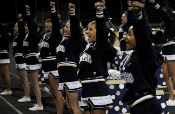 The Shadow Ridge cheerleaders try to get the home crowd ...