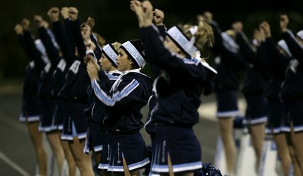 Centennial cheerleaders pull for their team after a Bulldogs touchdown. 