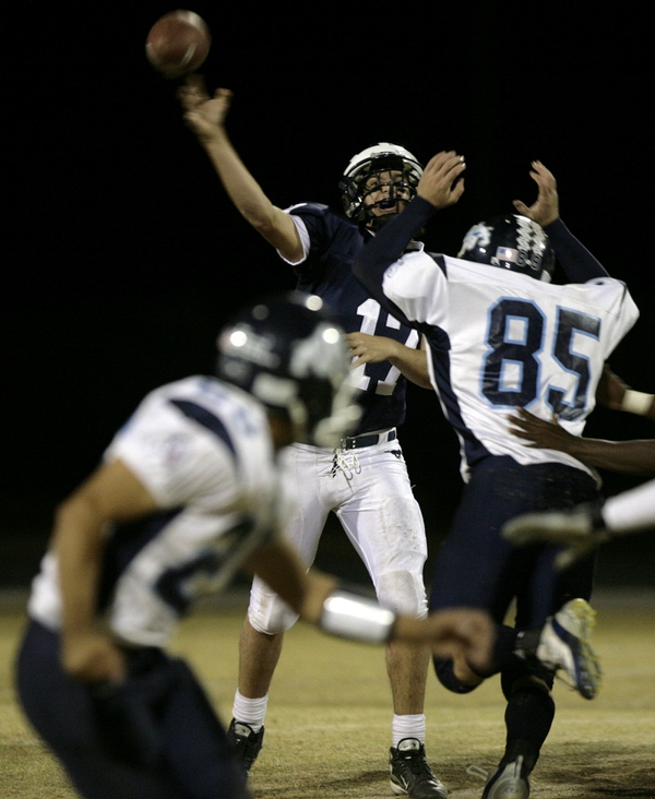 Shadow Ridge quarterback Matt Rodman gets the ball off before ...