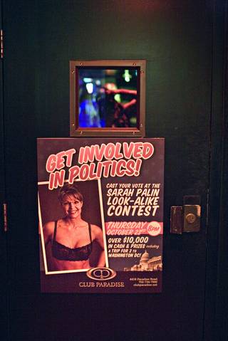 A sign on a door advertises a Republican vice presidential candidate Sarah Palin look-alike stripper contest at the Club Paradise strip club in Las Vegas. Contestants competed for $10,000 in prize money and a trip to Washington, D.C., for the presidential inauguration. 