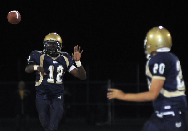 Grizzlies quarterback Anton Stallworth (12) delivers a short pass to ...
