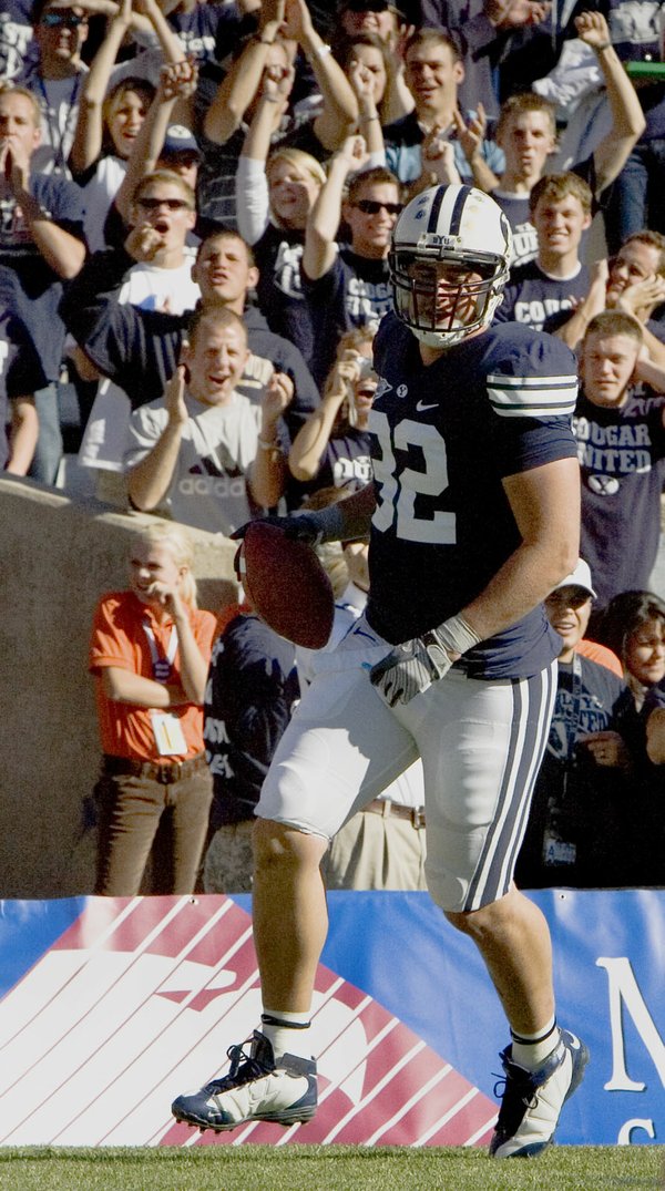 BYU tight end Dennis Pitta (32) is cheered for making ...