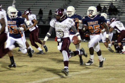 Cimarron-Memorial junior Kenneth Banks runs with the ball during Friday's game at Legacy.