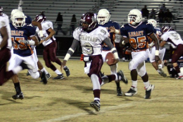 Cimarron-Memorial junior Kenneth Banks runs with the ball during Friday's ...