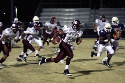 Cimarron-Memorial junior Stephen Nixon runs the ball during Friday's game at Legacy.