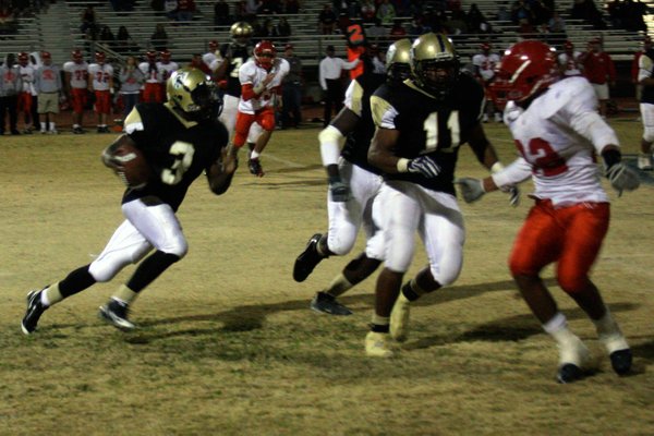 Cheyenne's Marcus Sullivan runs the ball during Friday's game against ...