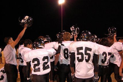 Clark players huddle before leaving the field at Sierra Vista High School Friday night. Clark's playoff hopes ended when the team lost to Sierra Vista, 20-14.