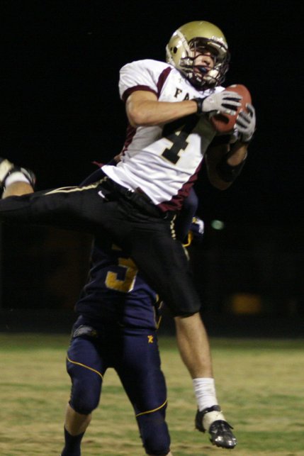 Faith Lutheran wide receiver Don Pearson leaps to catch the ball during a football game at Boulder City High School on Friday.

