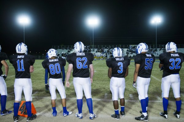 Basic's Austin Davis (11), Tyler Sanchez (80), Erick Rubeck (62), ...